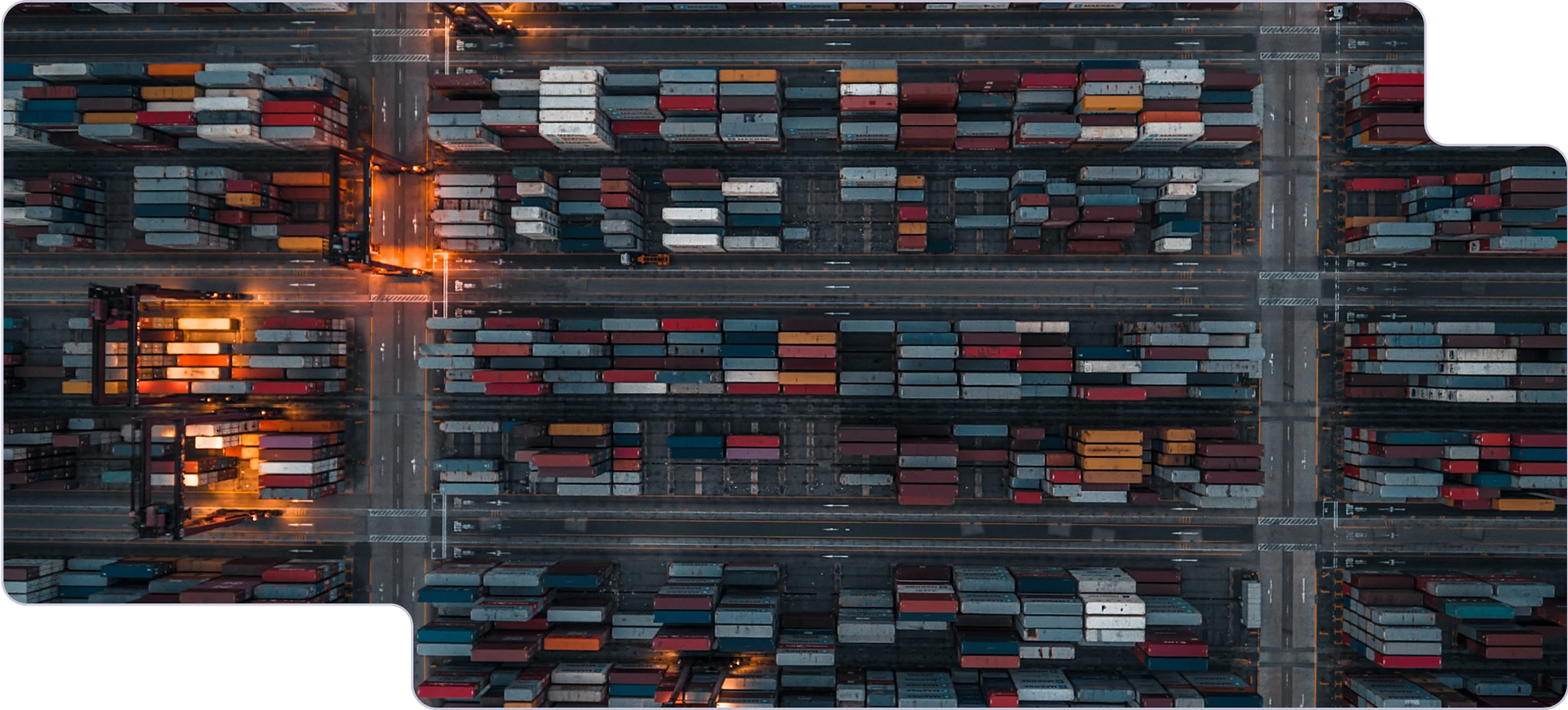 A top-down view showing a shipping yard, with hundreds of shipping containers in sight